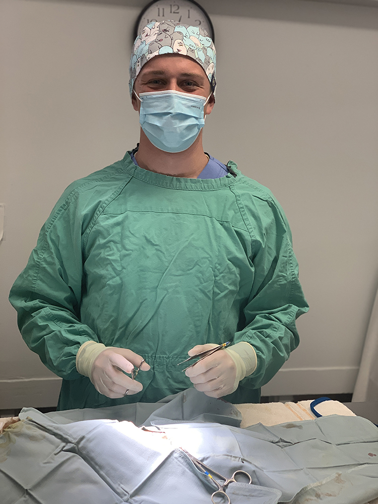 Collin in surgical scrubs.
