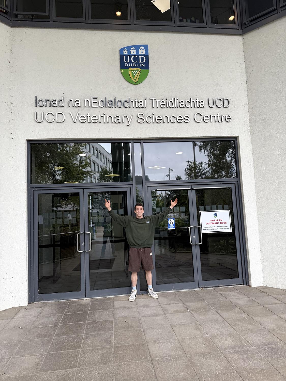 Person standing outside the front door of the UCD Veterinary Science Centre, Dublin.