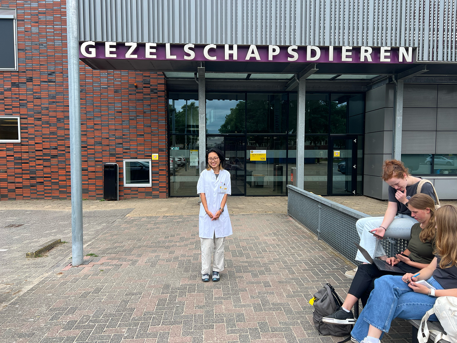 A person standing in front of a clinic.