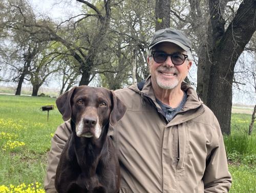 man with dog in park