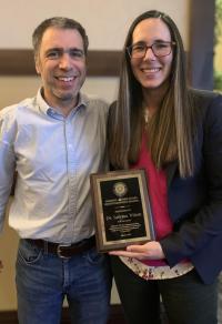 Drs. Mathieu Spriet (left) and Sabrina Wilson with Dr. Wilson's Resident Author Award.