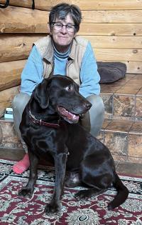 dog with woman in cabin