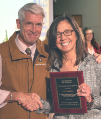 Dr. Lisa Miller receiving a 2024 Faculty Award