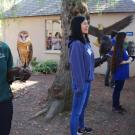 students holding raptors for display